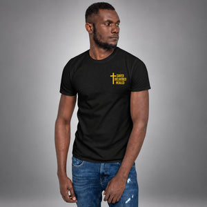 Man wearing a black Saved Delivered Healed embroidered cross t-shirt, front view