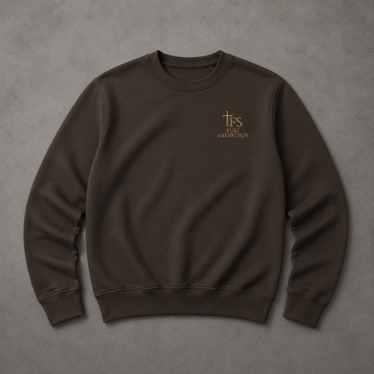 Flat lay of the Full Salvation Apparel Essential Organic Cotton Crewneck Sweatshirt in Deep Charcoal Grey with embroidered gold cross emblem
